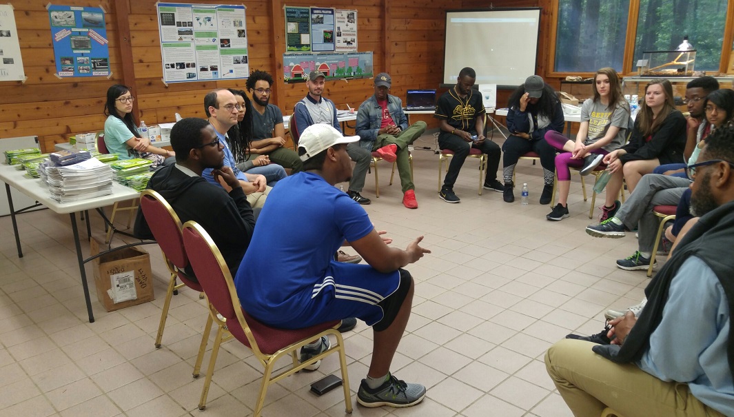 Group meeting, people seating in a circle