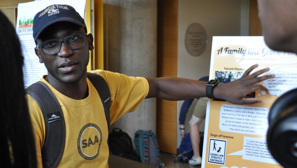 Man explaining a poster